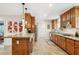 Spacious kitchen with granite counters, wood cabinets, stainless steel appliances and tile flooring at 7042 N 13Th St, Phoenix, AZ 85020