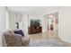 Inviting living room area offering relaxing sitting areas and travertine flooring at 7042 N 13Th St, Phoenix, AZ 85020