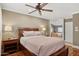 Relaxing main bedroom featuring warm colors, hardwood floors and a ceiling fan at 7042 N 13Th St, Phoenix, AZ 85020