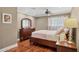 Comfortable main bedroom with hardwood floors and ceiling fan at 7042 N 13Th St, Phoenix, AZ 85020