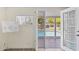 View from inside of the pool and patio area with an open door for easy access to inside at 7042 N 13Th St, Phoenix, AZ 85020