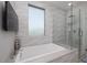 Spa-like bathroom with a soaking tub, glass-enclosed shower, and decorative tile at 7347 E Vista Bonita Dr, Scottsdale, AZ 85255