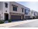 Street view of modern townhomes with attached garages and manicured front yard landscaping at 7347 E Vista Bonita Dr, Scottsdale, AZ 85255