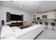 Open-concept living room with white sofa, sleek TV, and modern decor at 7347 E Vista Bonita Dr, Scottsdale, AZ 85255