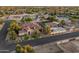 Aerial view of a luxury home featuring mature landscaping, a circular driveway, and guest house at 7425 W Caro Rd, Glendale, AZ 85308