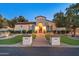 Inviting single-story home with manicured landscaping and a charming brick pathway leading to the front entrance at 7425 W Caro Rd, Glendale, AZ 85308