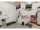 Garage boasts ample storage, a convenient sink area, and a wall-mounted television at 7425 W Caro Rd, Glendale, AZ 85308