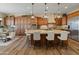 Spacious kitchen boasts a large island, stylish pendant lighting and open concept at 7425 W Caro Rd, Glendale, AZ 85308