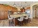 Modern kitchen with stainless steel appliances, a large island, and ample cabinet space at 7425 W Caro Rd, Glendale, AZ 85308