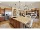 Gourmet kitchen boasts stainless steel appliances, a large island, and open layout at 7425 W Caro Rd, Glendale, AZ 85308