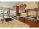 Beautiful kitchen with stainless steel appliances, tile backsplash, granite countertops, and custom cabinetry at 7425 W Caro Rd, Glendale, AZ 85308