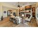 Inviting living room with fireplace, tile accent wall and an open floor plan at 7425 W Caro Rd, Glendale, AZ 85308