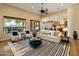 Bright living room boasts a large window, stylish furniture, and an open floor plan at 7425 W Caro Rd, Glendale, AZ 85308