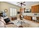 Comfortable living room with hardwood cabinets, built-in desk, leather sofa and beautiful accents at 7425 W Caro Rd, Glendale, AZ 85308