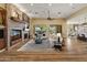 Spacious living room with fireplace, a large picture window and open floorplan at 7425 W Caro Rd, Glendale, AZ 85308