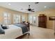 Bright, spacious bedroom with carpet, a ceiling fan, and a closet at 7425 W Caro Rd, Glendale, AZ 85308