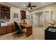 Well-lit home office with custom built-ins and ample workspace at 7425 W Caro Rd, Glendale, AZ 85308