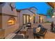 Inviting outdoor living space with a stone fireplace at 7425 W Caro Rd, Glendale, AZ 85308