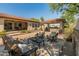 Covered patio featuring outdoor furniture, a seating area, and a grill at 7425 W Caro Rd, Glendale, AZ 85308