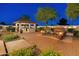 Expansive outdoor area featuring a complete outdoor kitchen and dining area with an outdoor fireplace at 7425 W Caro Rd, Glendale, AZ 85308