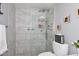 Contemporary bathroom featuring a sleek glass shower enclosure and elegant marble-look tile at 7950 E Camelback Rd # 308, Scottsdale, AZ 85251