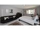 Spacious bedroom with a comfortable bed, neutral decor, and a large window offering natural light at 7950 E Camelback Rd # 308, Scottsdale, AZ 85251