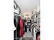 Organized walk-in closet with ample storage, hanging racks, and shelving for clothing and accessories at 7950 E Camelback Rd # 308, Scottsdale, AZ 85251