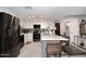 Modern kitchen with stainless steel appliances, center island with chairs, and white cabinets at 7950 E Camelback Rd # 308, Scottsdale, AZ 85251