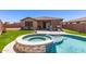 Well-maintained backyard with a beautiful swimming pool and spa, perfect for outdoor entertainment at 8418 W Palmaire Ave, Glendale, AZ 85305