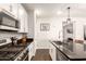 Well-equipped kitchen featuring stainless steel appliances, granite countertops, and abundant cabinet space at 8418 W Palmaire Ave, Glendale, AZ 85305