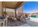 Inviting covered patio with comfortable seating and view of the swimming pool at 8418 W Palmaire Ave, Glendale, AZ 85305