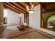 Cozy living room featuring wood-beamed ceilings, tile flooring, and large windows for natural light at 8637 E Appaloosa Trl, Scottsdale, AZ 85258