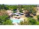 Community aerial shot featuring a pool, covered parking, and well-maintained landscaping at 921 W University Dr # 1023, Mesa, AZ 85201