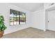Bedroom with a large window that fills the room with natural light, featuring a closet with louvered doors at 921 W University Dr # 1023, Mesa, AZ 85201