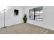 Bedroom features a large window that offers natural light, complemented by a picture and a houseplant at 921 W University Dr # 1023, Mesa, AZ 85201