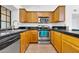 Well-equipped kitchen with granite countertops, wood cabinets, and stainless steel appliances at 921 W University Dr # 1023, Mesa, AZ 85201