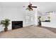Spacious living room with a decorative fireplace and views into the kitchen at 921 W University Dr # 1023, Mesa, AZ 85201