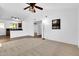 Inviting living room with neutral carpet, a ceiling fan, and an open floor plan at 921 W University Dr # 1023, Mesa, AZ 85201