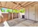 Covered patio with brick wall, access to a utility room and a view of the well-maintained yard at 921 W University Dr # 1023, Mesa, AZ 85201