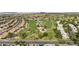 Panoramic aerial view of a meticulously maintained golf course and residential area at 9826 W Tonto Ln, Peoria, AZ 85382