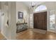 Elegant entryway with hardwood floors, a decorative table, and a stylish chandelier at 9826 W Tonto Ln, Peoria, AZ 85382