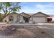 Attractive single-story home with a desert-style front yard and comfortable seating on the front porch at 9826 W Tonto Ln, Peoria, AZ 85382