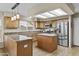 Well-equipped kitchen features ample counter space, modern appliances, and stylish cabinetry at 9826 W Tonto Ln, Peoria, AZ 85382