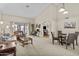 Spacious living room with high ceilings, plush furniture, and abundant natural light at 9826 W Tonto Ln, Peoria, AZ 85382