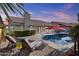 Inviting backyard with a sparkling pool, lounge chairs, and lush landscaping at 9826 W Tonto Ln, Peoria, AZ 85382
