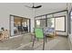 Inviting sunroom provides relaxing atmosphere, lots of natural light, and access to the outdoors at 9826 W Tonto Ln, Peoria, AZ 85382