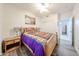 Charming bedroom features a ceiling fan, wood-look floors, and light-colored walls at 10832 W Piute Ave, Peoria, AZ 85373
