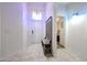 Bright entryway featuring a bench with storage and a view into an adjacent bedroom at 10832 W Piute Ave, Peoria, AZ 85373