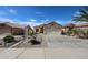 Lovely home with desert landscaping and a two-car garage, showcasing curb appeal at 10832 W Piute Ave, Peoria, AZ 85373