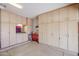 Spacious garage featuring custom built-in cabinetry and ample storage space, perfect for organization at 10832 W Piute Ave, Peoria, AZ 85373